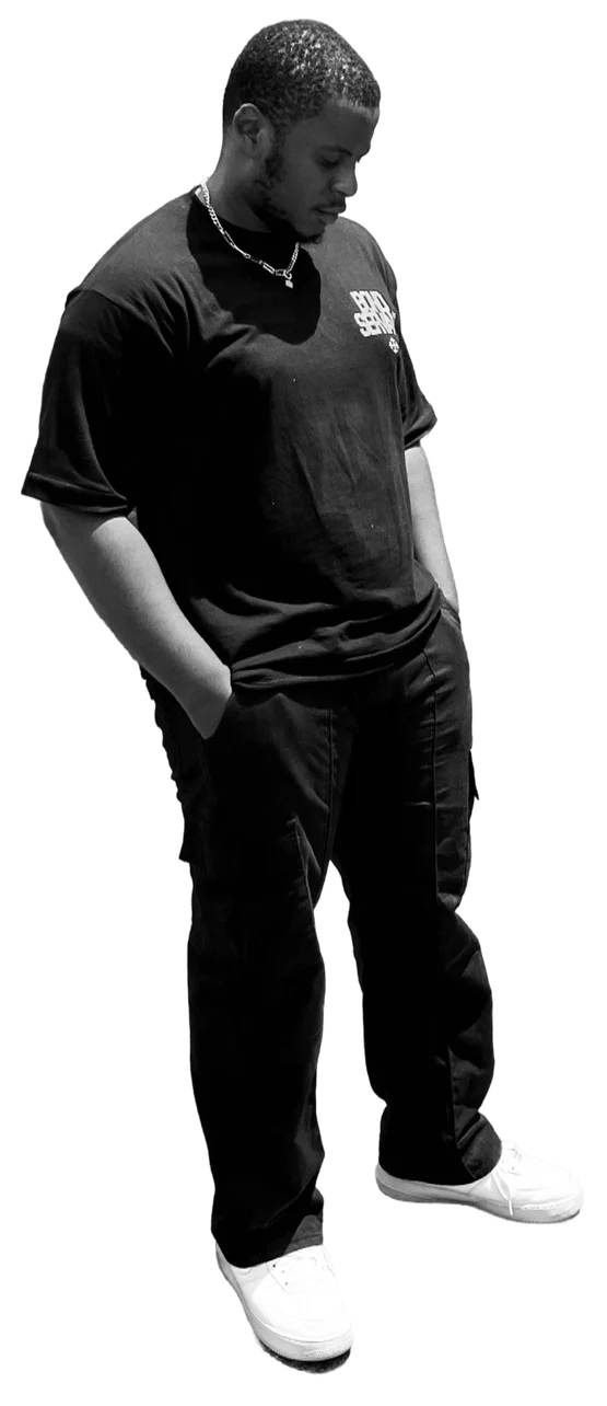Samuel in a black t-shirt and trousers