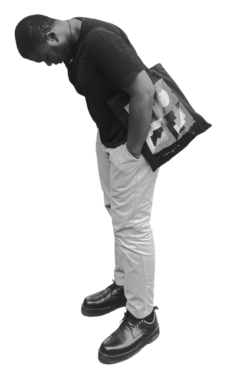 Samuel holding a tote bag